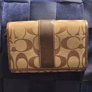 Coach Hampton Signature Wallet brown in color with smooth brown leather trim